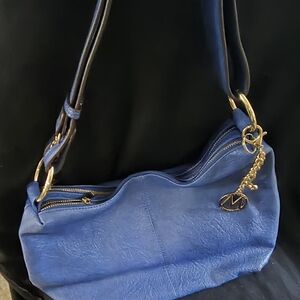 Chic Blue Shoulder Bag with Gold Accents